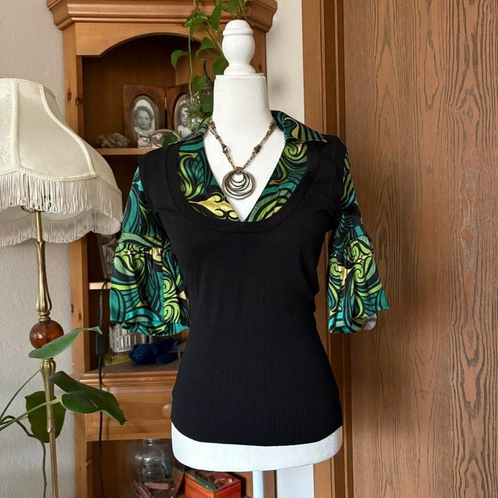 bebe Black Top with Green and Teal Swirl Sleeve Accents. Silk blend